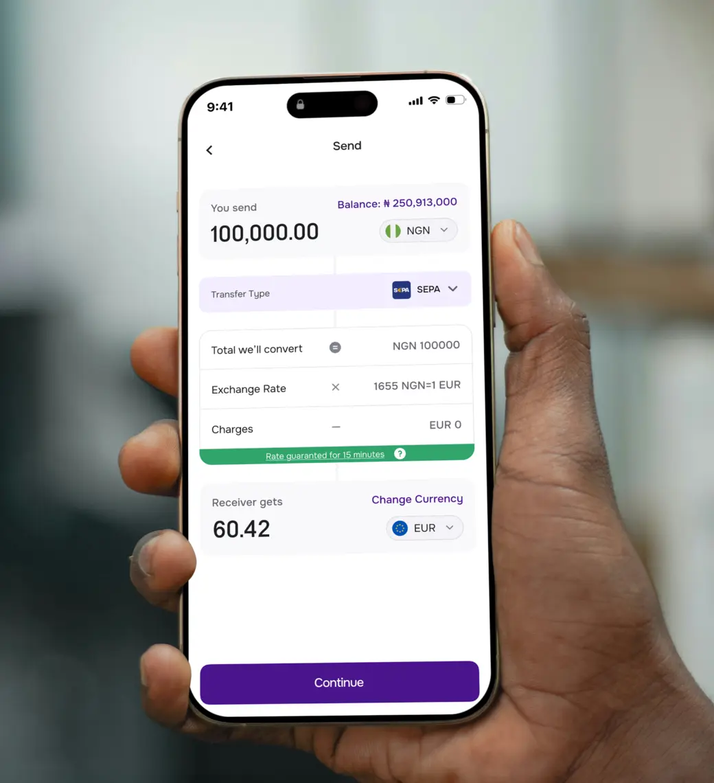 Hand holding a phone with the CadRemit app open