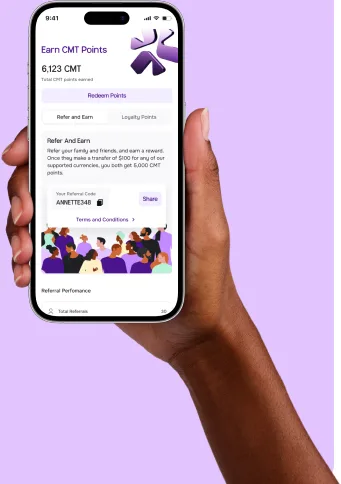 Hand holding a phone with the CadRemit app open