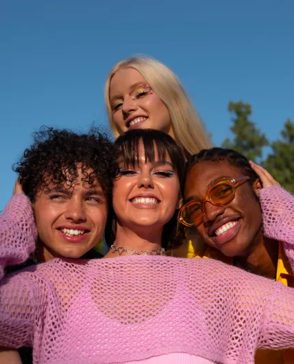 Friends smiling together outdoors