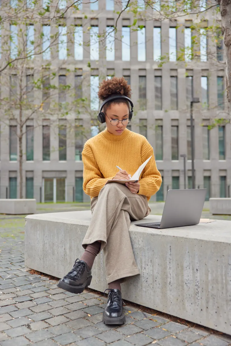 Student studying outside campus