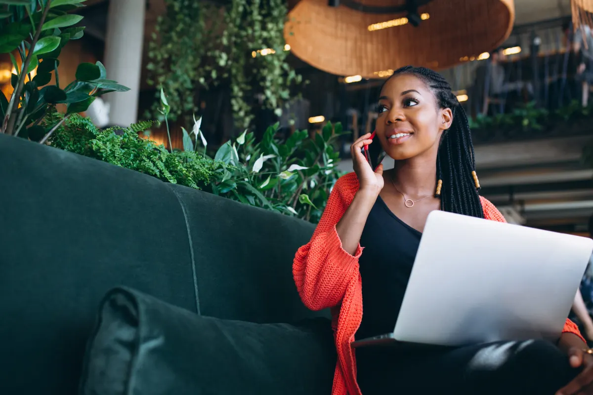 Woman on a call while working on a laptop