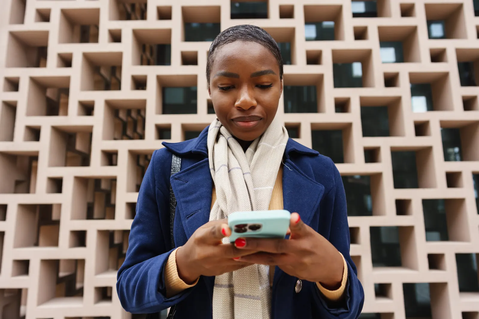 Woman smiling at her phone