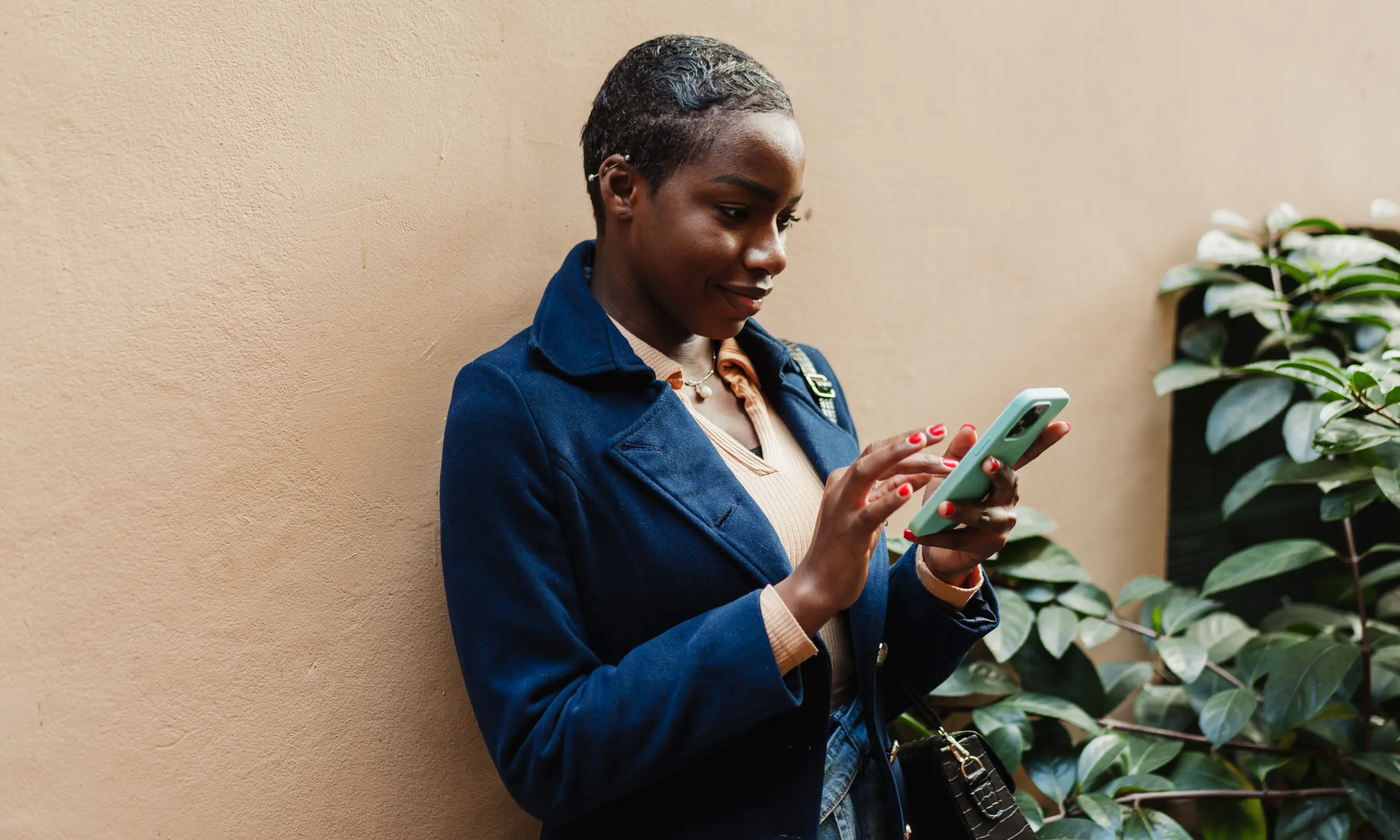 Woman downloading the CadRemit app on her phone