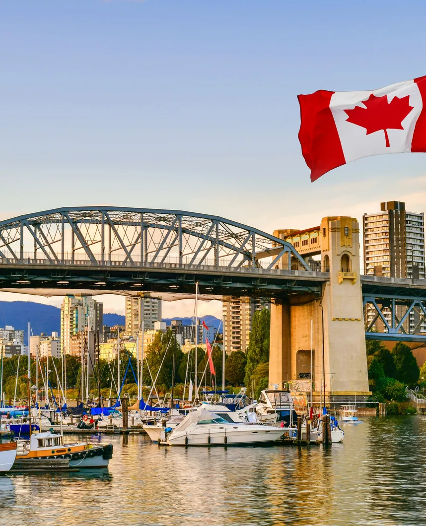 Canadian flag over the Burrard Bridge in Vancouver